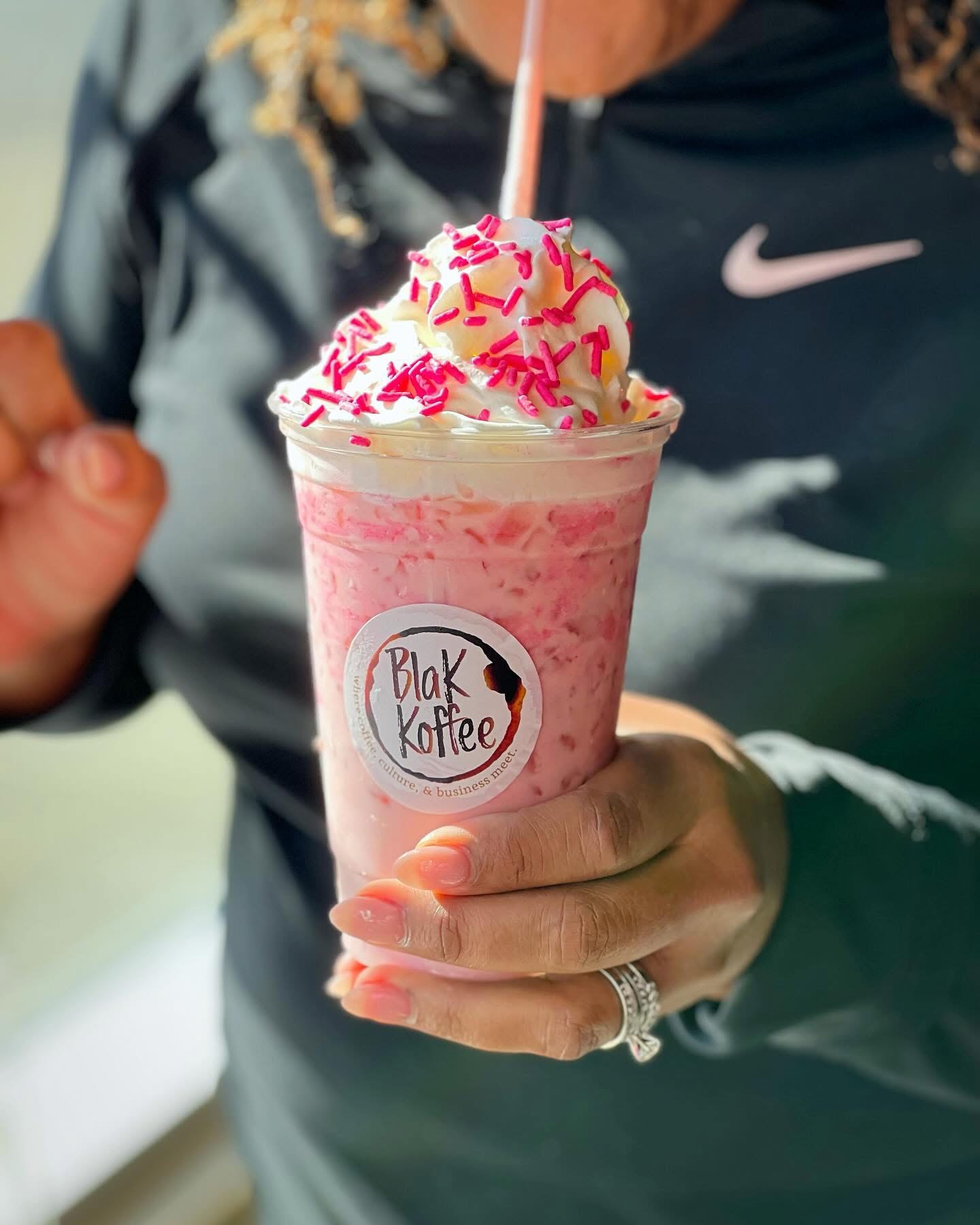 Pink strawberry frappe with sprinkles and whipped cream