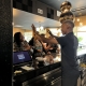 Blak Koffee Employee celebrating with customer
